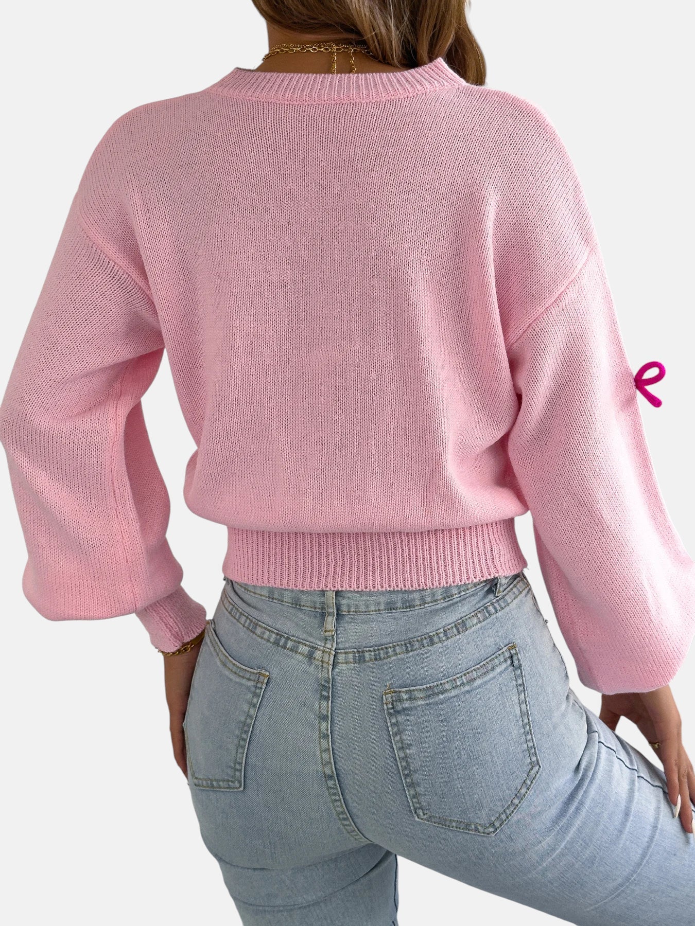 Pull rose à nœuds colorés