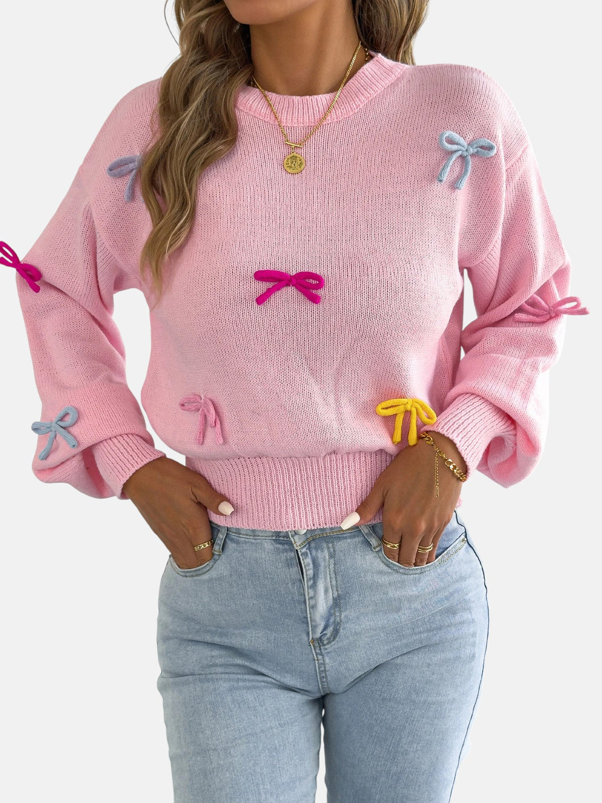 Pull rose à nœuds colorés