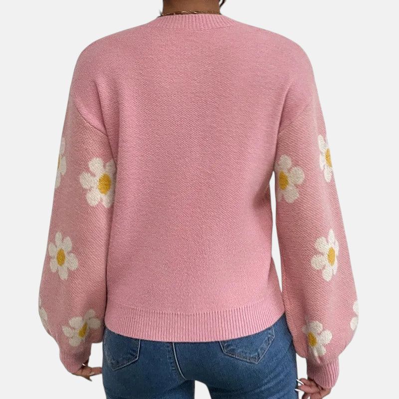 Pull rose avec fleurs